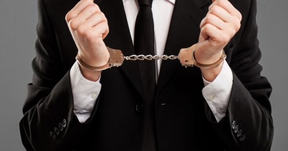 businessman-with-manacles-his-hands-1